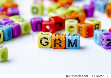 GRM text on multicolored cubes representing Grievance Redress Mechanism. Conservation concept. 131825597