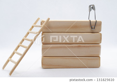 A figure pin on top of wooden blocks with customizable space for text or ideas. 131825610
