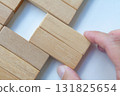 Hand placing wooden blocks with customizable space for text or ideas. Copy space and advertisement concept. 131825654