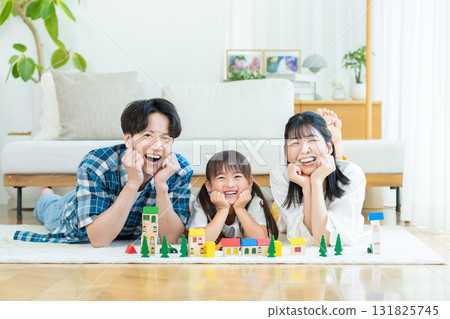 Families playing in the living room Families playing in the living room 131825745