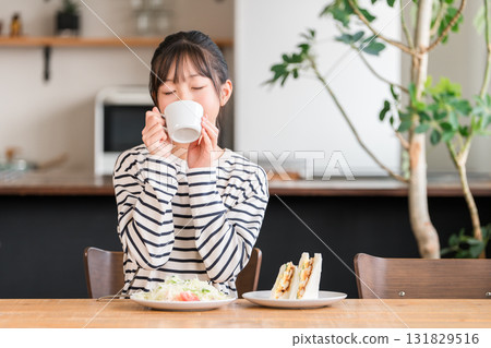 Girls drinking milk, hot milk, soup, juice, coffee for breakfast, lunch Girls drinking milk, hot milk, soup, juice, coffee for breakfast, lunch 131829516