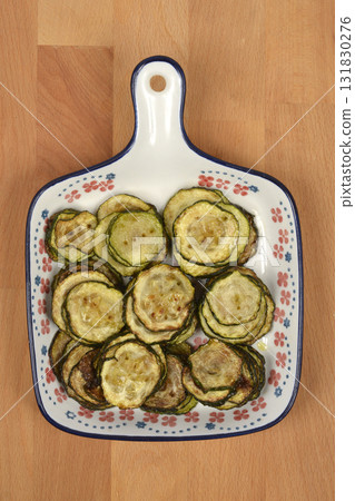 Fried Zucchini Slices on Platter 131830276