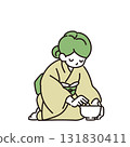 A woman making tea 131830411