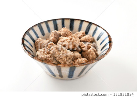 Processed brown sugar made from sugarcane grown in Okinawa Processed brown sugar made from sugarcane grown in Okinawa 131831854