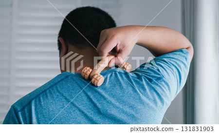 Handheld massager relieves stress home indoor close-up wellness 131831903