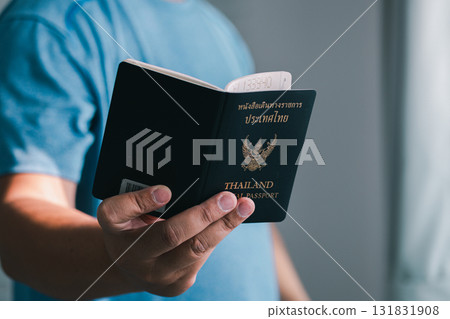 Hand holding thai passport travel preparation indoors personal viewpoint journey insights 131831908