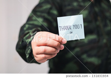 Soldier expresses gratitude with thank you note military base indoor close-up appreciation 131831934