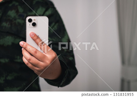 Capturing moments smartphone selfie cozy indoor setting with natural lighting 131831955