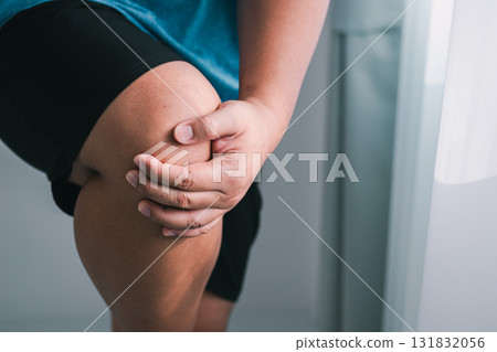 Knee pain relief techniques using hands for healing home setting health tips close-up view wellness insights Knee pain relief techniques using hands for healing home setting health tips close-up view wellness insights 131832056