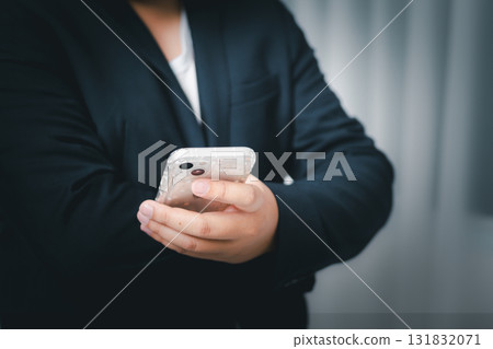 Mobile phone interaction urban setting candid focused environment close-up view daily life concept Mobile phone interaction urban setting candid focused environment close-up view daily life concept 131832071