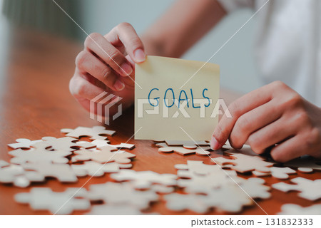 Setting business goals inspirational strategies for success professional office motivational content focused environment Setting business goals inspirational strategies for success professional office motivational content focused environment 131832333