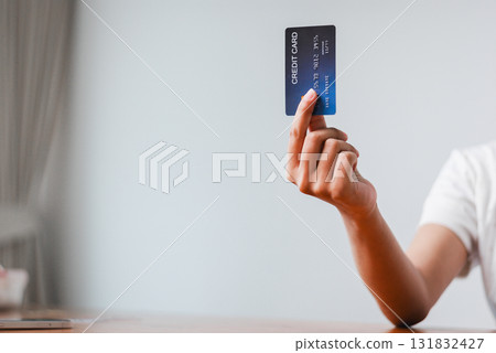 Making a payment with a credit card home office digital content indoor close-up financial management 131832427