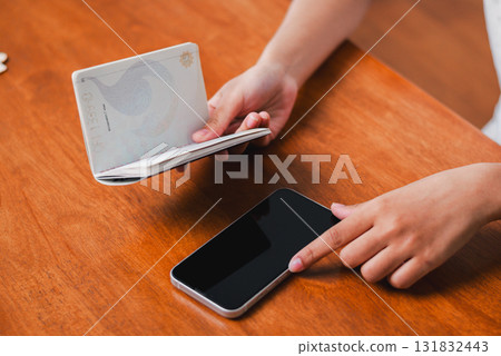 Smartphone and wallet interaction modern home lifestyle image cozy environment close-up perspective daily routines Smartphone and wallet interaction modern home lifestyle image cozy environment close-up perspective daily routines 131832443