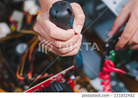Repairing electronics equipment workshop action scene indoor close-up view technical skill Repairing electronics equipment workshop action scene indoor close-up view technical skill 131832482