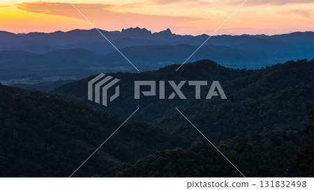 Sunset over mountain ranges scenic landscape nature calm environment wide angle view Sunset over mountain ranges scenic landscape nature calm environment wide angle view 131832498
