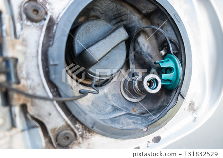 Fuel pump inspection and maintenance tips for vehicles automotive garage guide close-up view mechanics Fuel pump inspection and maintenance tips for vehicles automotive garage guide close-up view mechanics 131832529