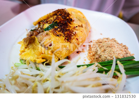 Delicious omelette dish local market food vibrant setting close-up culinary experience Delicious omelette dish local market food vibrant setting close-up culinary experience 131832530