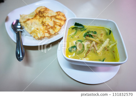Delicious chicken curry and roti local restaurant food cozy eatery close-up culinary delight Delicious chicken curry and roti local restaurant food cozy eatery close-up culinary delight 131832570