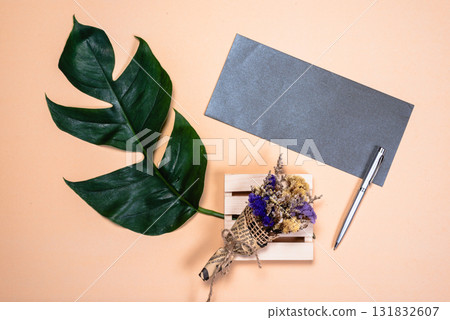 Floral arrangement and writing tools home office still life minimalist top view creative inspiration 131832607