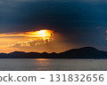 Dramatic sunset over mountain landscape ocean view serene nature scene tranquil evening 131832656