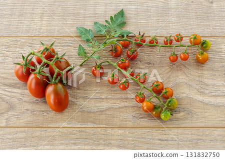 Just picked fresh tomatoes on the wooden background. Just picked fresh tomatoes on the wooden background. 131832750