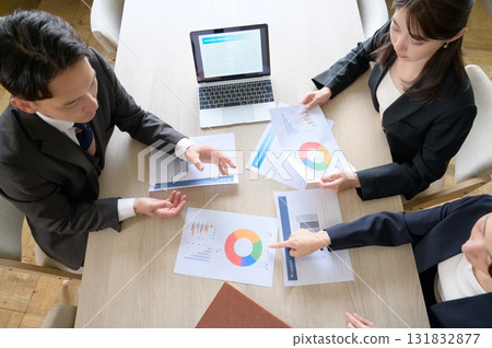 Aerial view of men and women having a meeting 131832877