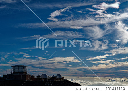 An observatory on a southern island floating in a sea of clouds 131833110