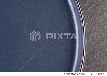 blue bowl made of baked clay and painted blue, beautifully evenly colored blue ceramic bowl for eating and serving dishes 131833264