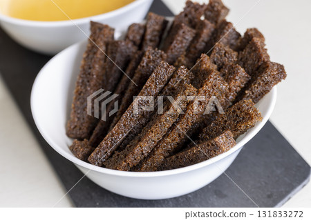 fried bread until crisp in oil with spices, delicious crispy rye bread croutons for cheese sauce fried bread until crisp in oil with spices, delicious crispy rye bread croutons for cheese sauce 131833272