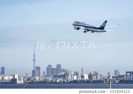 Scenery of Haneda Airport, plane taking off and Tokyo Skytree, Ota Ward, Tokyo 131834123