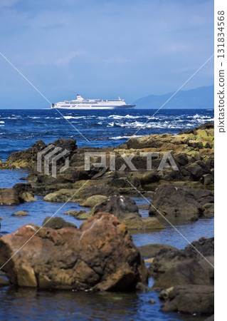 Cape Tappi in summer - View of the Shin Nihonkai Ferry Lilac sailing through the Tsugaru Strait from Takihama Beach 131834568