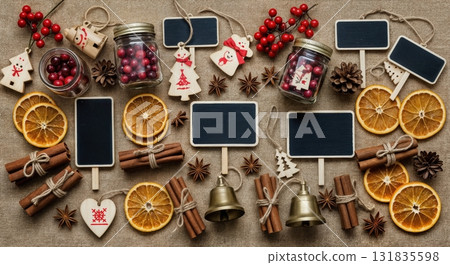 Rustic Christmas Market Flat Lay with Burlap Fabric Mason Jars Cranberries Wooden Ornaments and Vintage Brass Bells 131835598