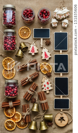 Rustic Christmas Market Flat Lay with Burlap Fabric Mason Jars Cranberries Wooden Ornaments and Vintage Brass Bells 131835606