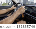 Mens hands on the streering wheel of the car 131835749