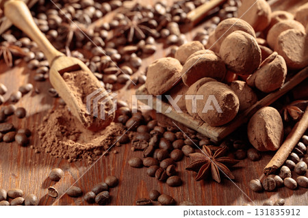 Chocolate truffles and cacao powder. Chocolate truffles and cacao powder. 131835912
