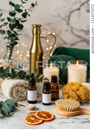Luxurious Christmas Spa Setting with Essential Oil Bottles Eucalyptus Bundles and Bath Salts in Glass Jars 131835972