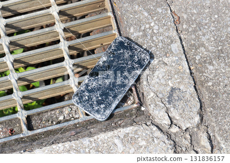 A broken smartphone dropped on the road A broken smartphone dropped on the road 131836157