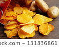 Potato chips , delicious BBQ seasoning spicy for crips, thin slice deep fried snack fast food. 131836861