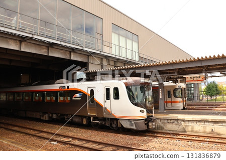 JR Takayama Main Line Limited Express Hida and local trains stopping at the platform at Takayama Station 131836879
