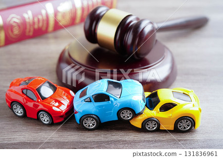 Bangkok, Thailand March 15, 2023 Car accident lawsuit and insurance, Judge hammer with car model. Bangkok, Thailand March 15, 2023 Car accident lawsuit and insurance, Judge hammer with car model. 131836961