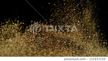 Powerful burst of clay particles exploding upward in a dense cloud, isolated on black. High-speed photography capturing the dynamic texture of dry earth in motion. 131837250