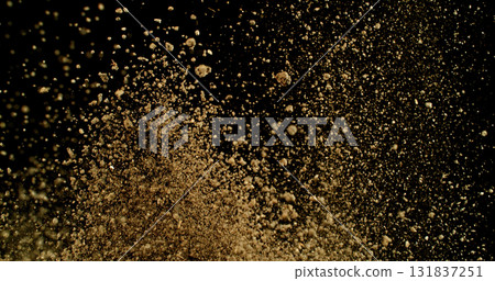 Powerful burst of clay particles exploding upward in a dense cloud, isolated on black. High-speed photography capturing the dynamic texture of dry earth in motion. 131837251
