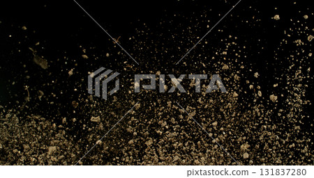 Detailed wave of airborne clay dust swirling in chaotic motion, captured in freeze  motion. Dramatic natural explosion of earthy particles on black background. 131837280