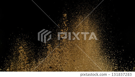 Detailed wave of airborne clay dust swirling in chaotic motion, captured in freeze  motion. Dramatic natural explosion of earthy particles on black background. 131837283