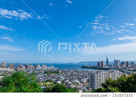 Fukuoka - Cityscape overlooking the blue sky and greenery of Hakata Bay Fukuoka - Cityscape overlooking the blue sky and greenery of Hakata Bay 131837333