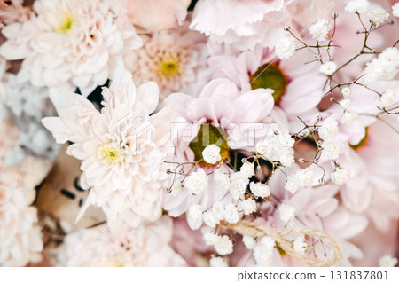 Soft pink and white floral arrangement with babys breath and delicate textures used in symbolic visual storytelling. Florals in emotional branding, sentimental design, poetic product styling 131837801