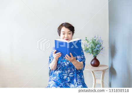 Senior woman reading a book, upper body, elderly person reading Senior woman reading a book, upper body, elderly person reading 131838518