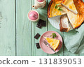 Delicious lemon cheesecake with tea set for dessert presentation. Top view flat lay background. Copy space. 131839053