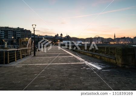Cobblestone walkways and streetlights along Concha Beach in San Sebastian at sunrise 131839169