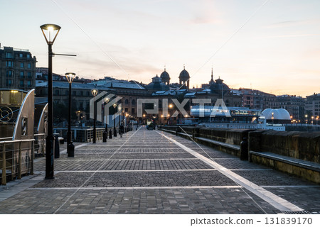 Cobblestone walkways and streetlights along Concha Beach in San Sebastian at sunrise Cobblestone walkways and streetlights along Concha Beach in San Sebastian at sunrise 131839170